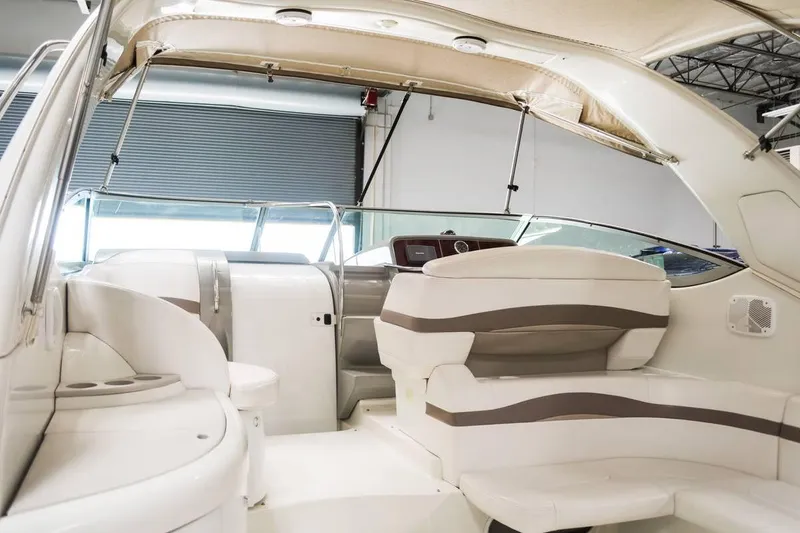 Slide: The Image of 2002 Formula 37 Performance Cruiser interior with beige seating and modern design. - 8