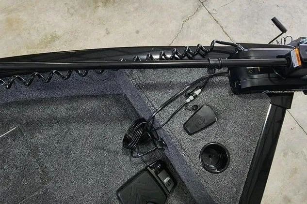 Slide: The Image of 2026 Tracker Super Guide V-16 SC boat interior with trolling motor and foot pedal. - 7