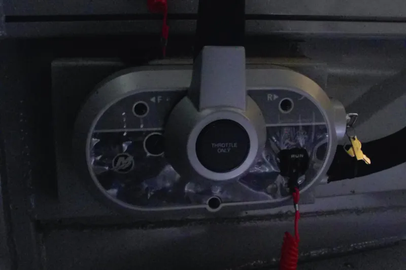 Slide: The Image of Control panel of 2024 Smoker Craft Phantom 20 X2 boat with throttle and ignition keys. - 11