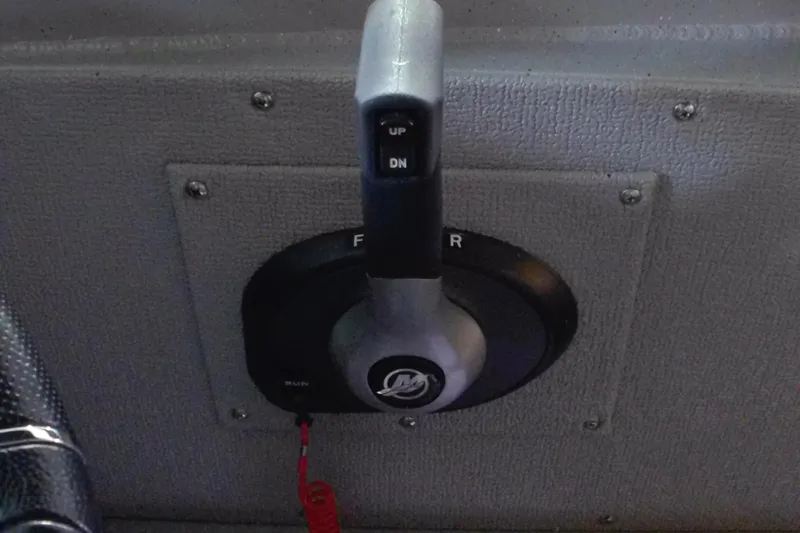 Slide: The Image of 2024 Smoker Craft Phantom 20 X2 throttle control lever on boat dashboard. - 12