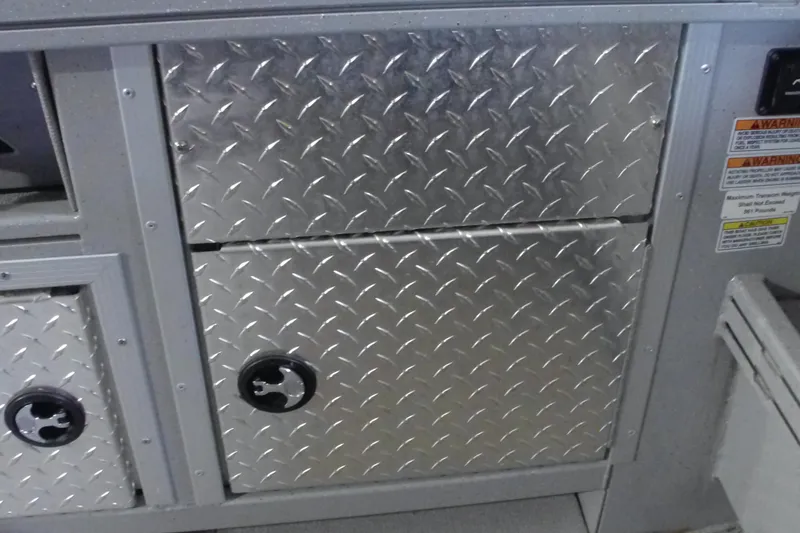 Slide: The Image of 2024 Smoker Craft Phantom 20 X2 aluminum storage compartment with diamond plate design. - 7