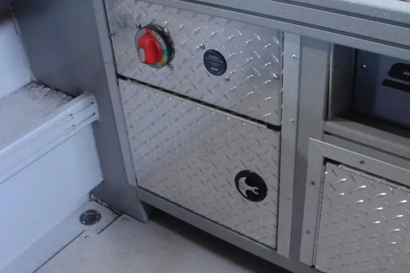 Slide: The Image of 2024 Smoker Craft Phantom 20 X2 interior with diamond plate storage compartments. - 8