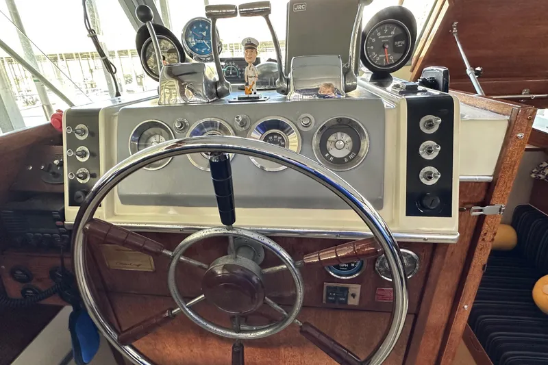 Slide: The Image of Vintage 1968 Chris-Craft 35 Commander helm with classic gauges and steering wheel. - 14