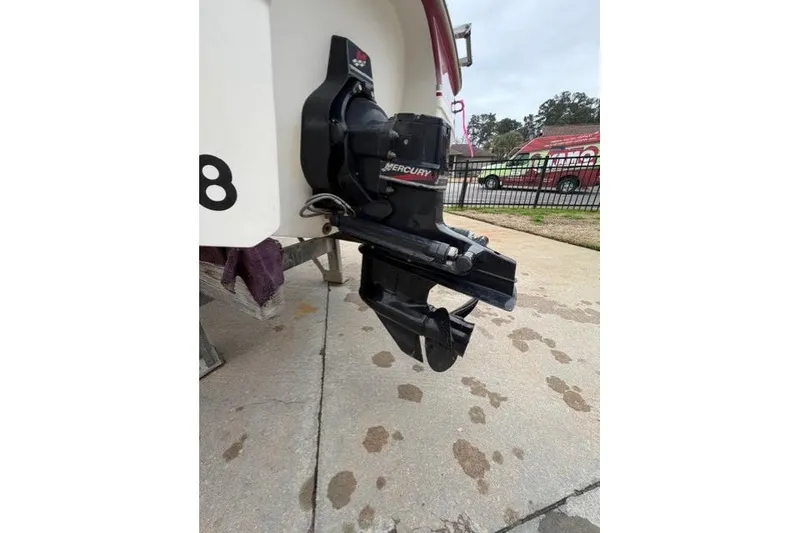 Slide: The Image of Outboard motor of 2000 Chaparral 232 Sunesta boat on a trailer. - 11