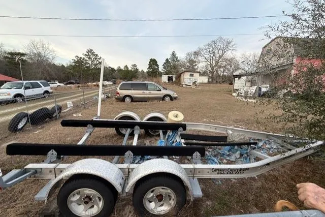 Slide: The Image of Trailer for 2000 Chaparral 232 Sunesta in a rural yard setting. - 16