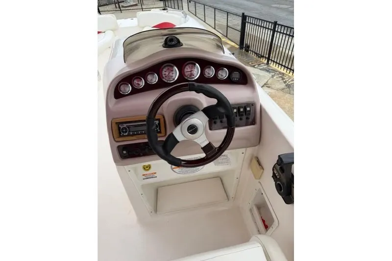 Slide: The Image of Steering console of 2000 Chaparral 232 Sunesta boat with gauges and controls. - 5