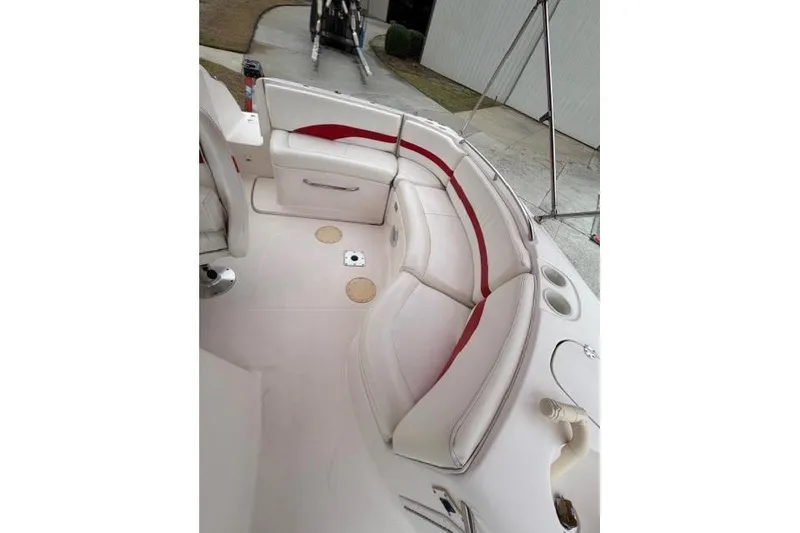 Slide: The Image of 2000 Chaparral 232 Sunesta boat interior with white and red seating. - 7