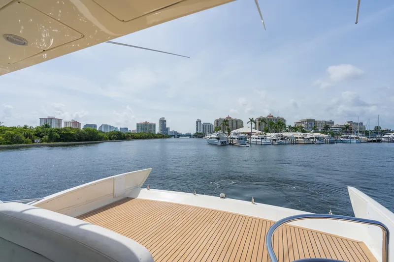 Slide: The Image of 2009 Azimut 62E yacht overlooking a marina. - 11