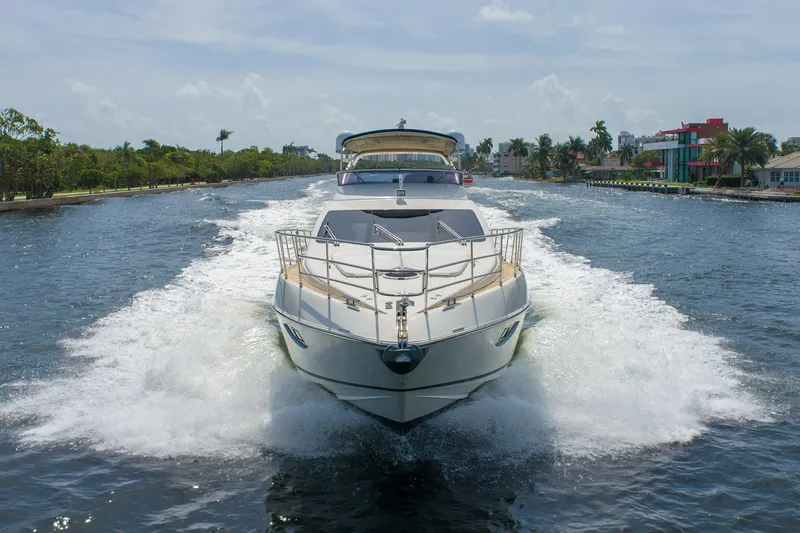Slide: The Image of 2009 Azimut 62E yacht cruising on water. - 3
