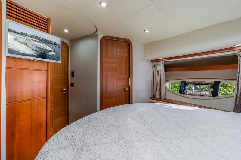 Slide: The Image of Interior of 2009 Azimut 62E yacht featuring a luxurious bedroom. - 39