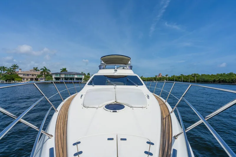 Slide: The Image of 2009 Azimut 62E yacht on calm waters near coastline. - 6