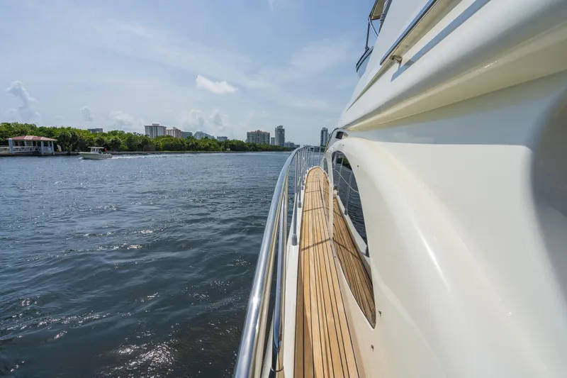 Slide: The Image of 2009 Azimut 62E yacht cruising on calm waters. - 8