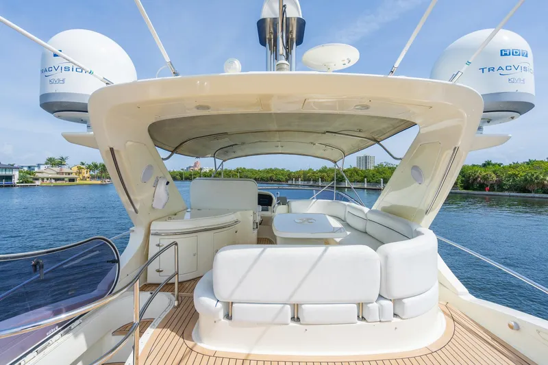 Slide: The Image of Luxury Azimut 62E 2009 yacht with spacious deck and seating area. - 9