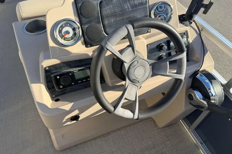 Slide: The Image of Steering console of 2021 Avalon 2480 GF boat with gauges and controls. - 10