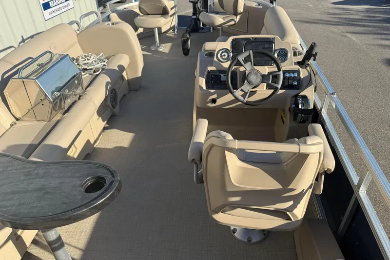 Slide: The Image of Interior of 2021 Avalon 2480 GF pontoon boat with steering console and seating. - 9