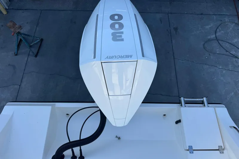 Slide: The Image of 2024 Cobia 237 Center Console with Mercury 300 outboard engine, top view. - 12