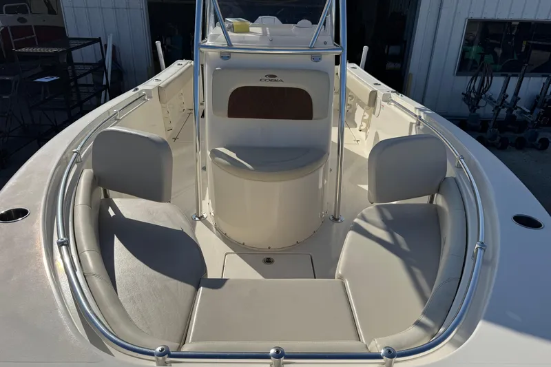 Slide: The Image of 2024 Cobia 237 Center Console boat interior with seating and console view. - 4