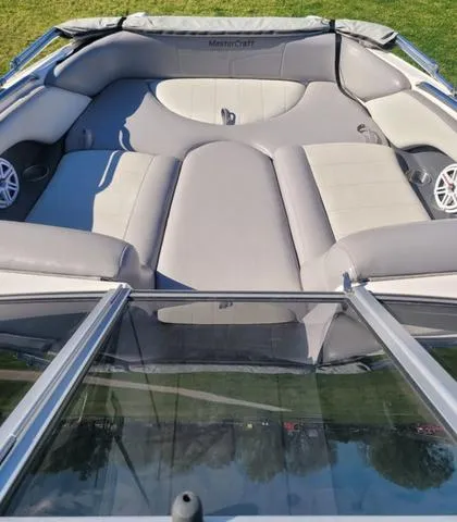 Slide: The Image of Interior of a 2008 MasterCraft MariStar 245 boat with gray upholstery. - 12