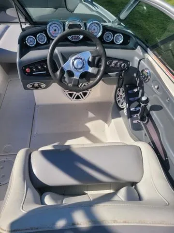 Slide: The Image of Interior of a 2008 MasterCraft MariStar 245 boat, steering console and seats. - 14