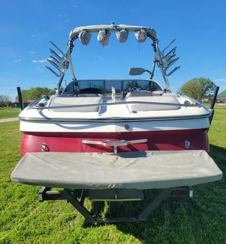 Slide: The Image of 2008 MasterCraft MariStar 245 boat on green grass. - 5