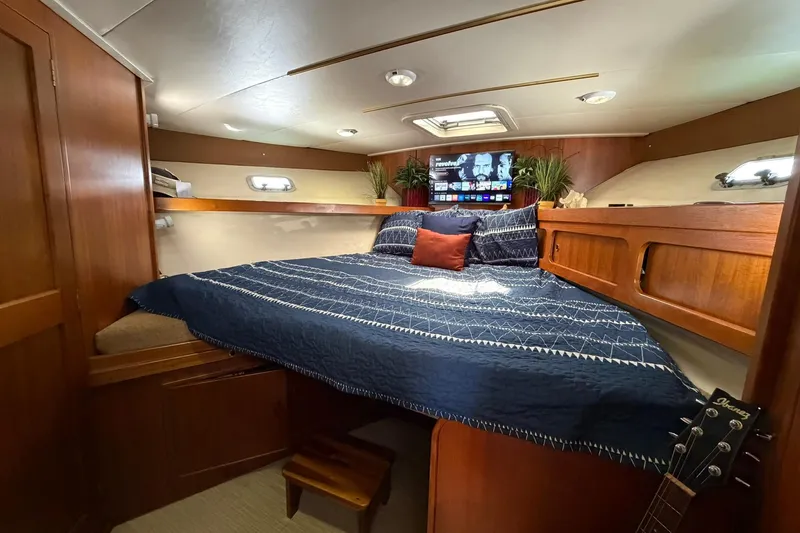Slide: The Image of Interior of 1993 Riviera 47 Open Flybridge yacht kitchen with appliances and wooden cabinetry. - 15