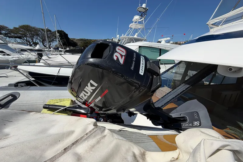 Slide: The Image of 1993 Riviera 47 Open Flybridge yacht docked in a marina under clear blue skies. - 28