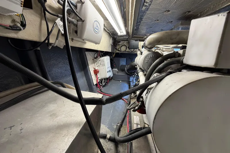 Slide: The Image of Engine room of 1993 Riviera 47 Open Flybridge with generator and equipment. - 33