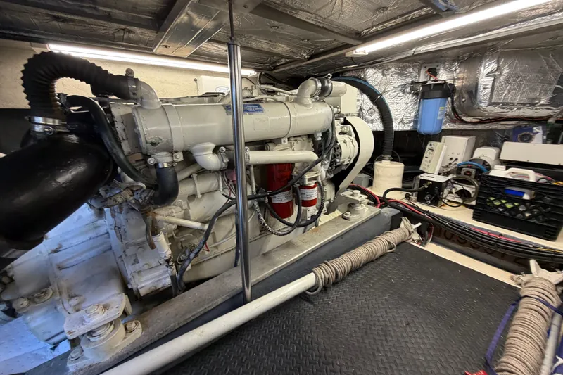 Slide: The Image of Engine room of 1993 Riviera 47 Open Flybridge with visible machinery and equipment. - 36