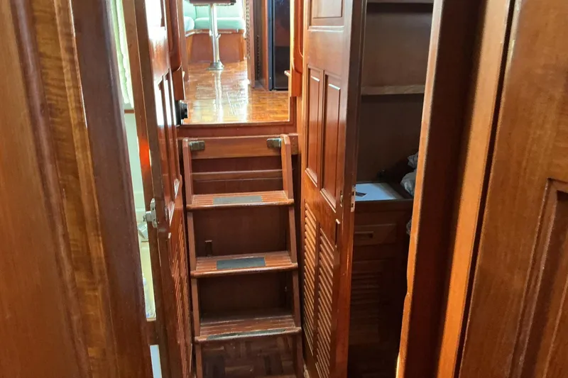 Slide: The Image of Interior of 1977 Universal Marine Europa yacht with wooden stairs and cabinetry. - 21