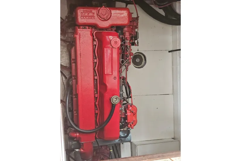 Slide: The Image of Red engine of a 1977 Universal Marine Europa boat, detailed view. - 37