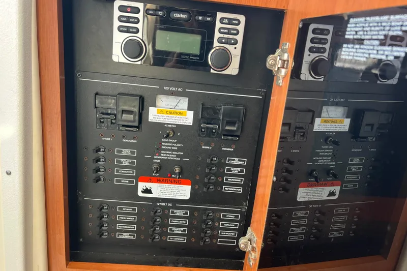 Slide: The Image of Electrical control panel on a 2006 Wellcraft 290 Coastal boat with stereo system. - 19