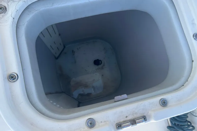 Slide: The Image of Livewell compartment on a 2006 Wellcraft 290 Coastal boat, showing interior details. - 24