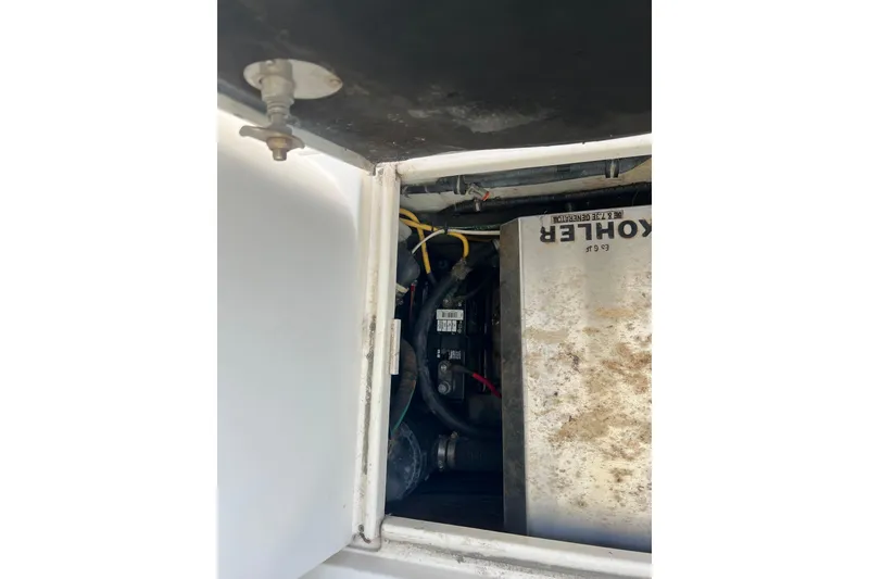 Slide: The Image of 2006 Wellcraft 290 Coastal engine compartment with Kohler generator visible. - 29