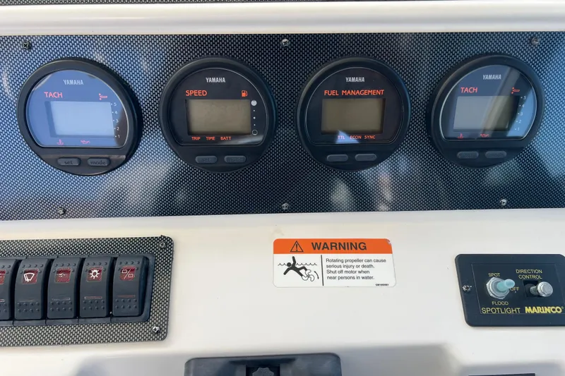 Slide: The Image of Dashboard of a 2006 Wellcraft 290 Coastal boat with Yamaha gauges and warning label. - 8