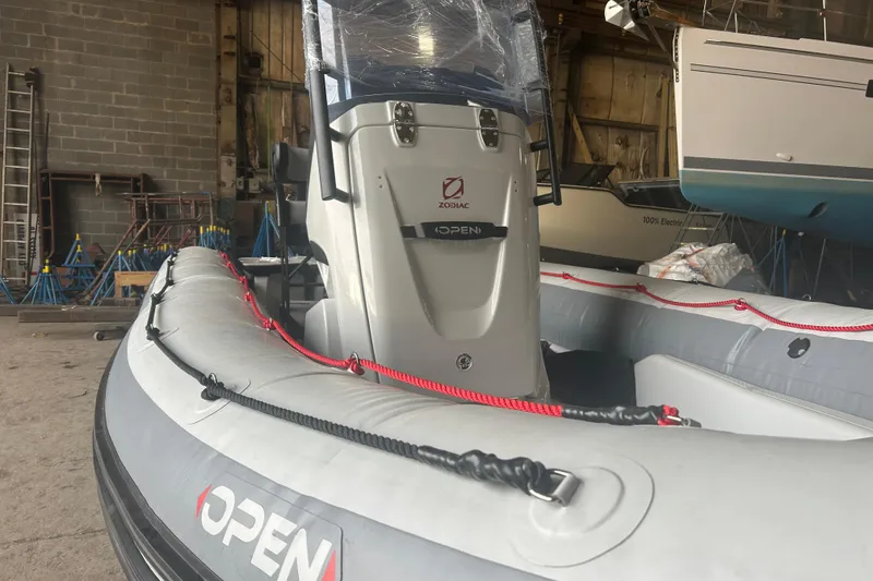 The Image of 2025 Zodiac Open 6.5 inflatable boat in a warehouse setting. - 0
