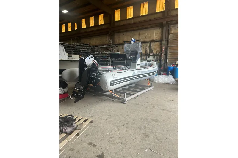 Slide: The Image of 2025 Zodiac Open 6.5 inflatable boat in a warehouse setting. - 11