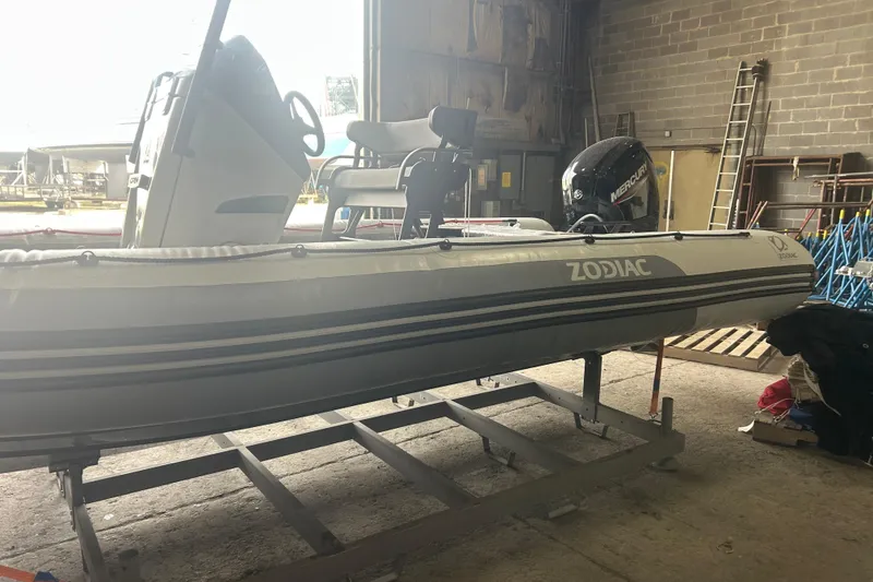 Slide: The Image of 2025 Zodiac Open 6.5 inflatable boat in a warehouse setting. - 4