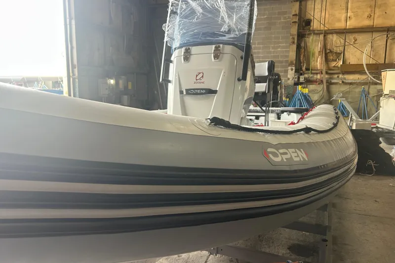 Slide: The Image of 2025 Zodiac Open 6.5 boat in a workshop, showcasing sleek design and modern features. - 5