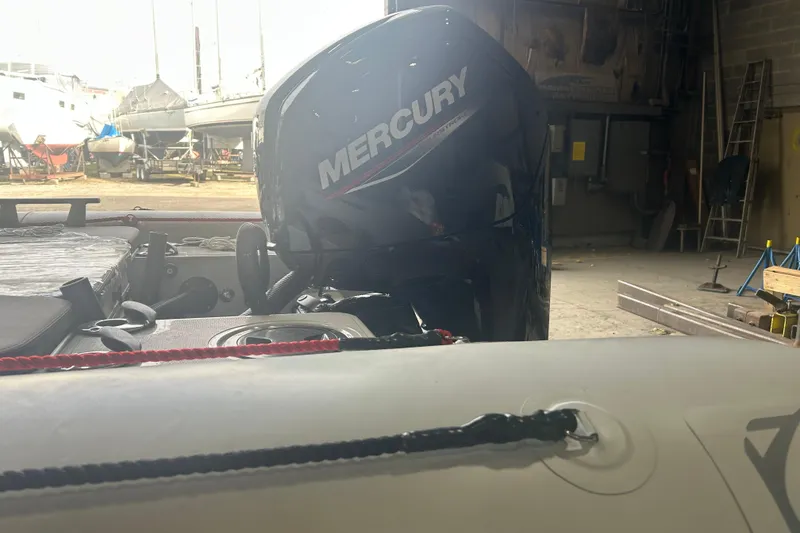 Slide: The Image of Zodiac Open 6.5 boat with Mercury engine in a workshop, 2025 model. - 6