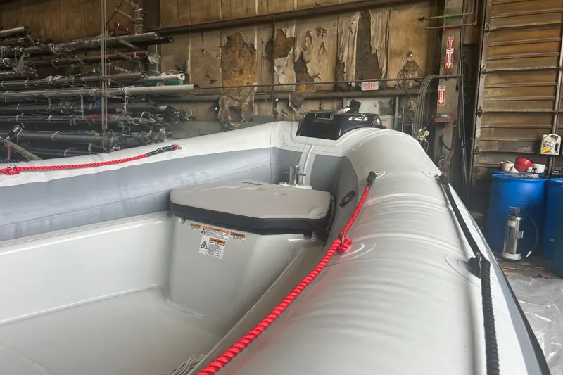 Slide: The Image of 2025 Zodiac Open 6.5 inflatable boat in a workshop setting. - 7