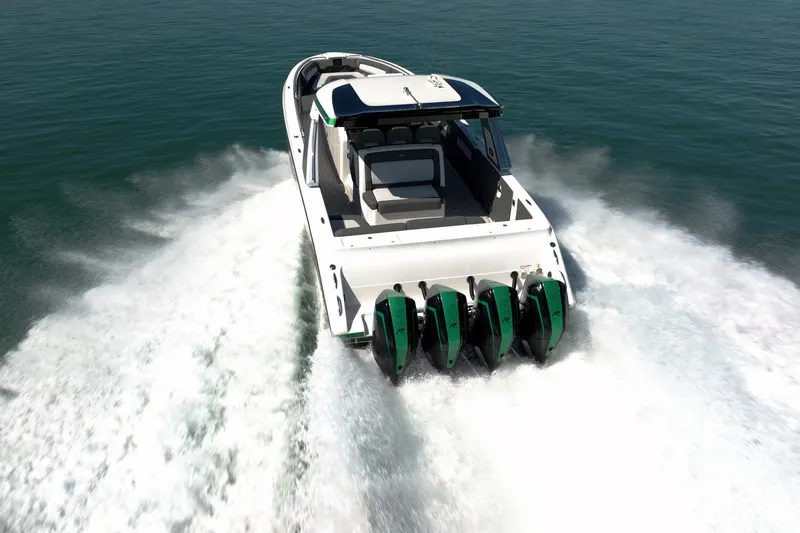 Slide: The Image of 2024 Cigarette 42' Auroris speedboat with four powerful engines cruising on open water. - 13