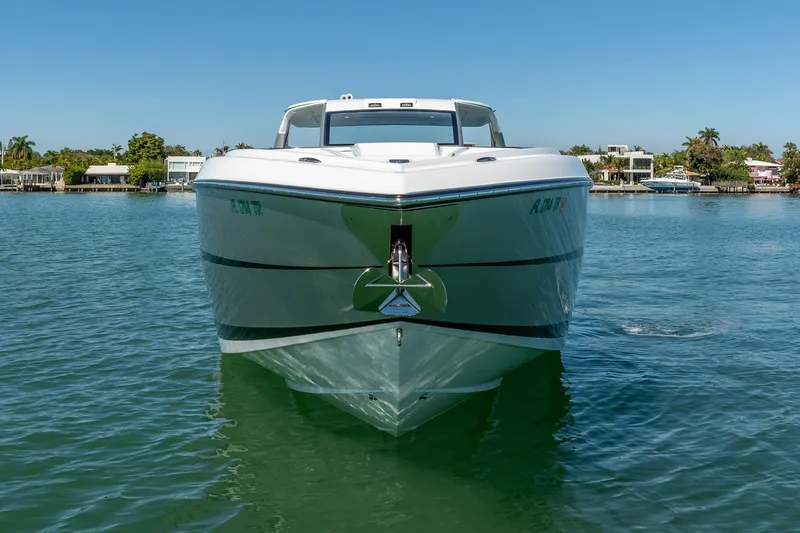 Slide: The Image of 2024 Cigarette 42' Auroris boat on calm water, front view. - 25