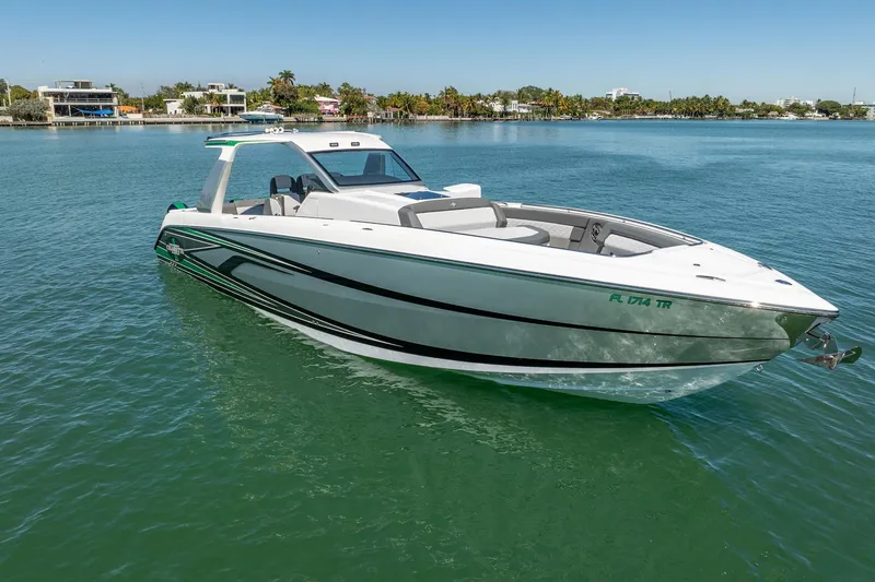 Slide: The Image of 2024 Cigarette 42' Auroris boat on calm water, showcasing sleek design and modern features. - 27