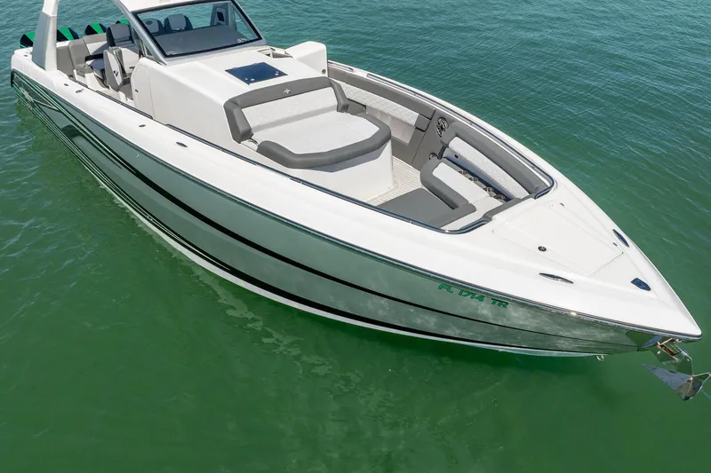 Slide: The Image of 2024 Cigarette 42' Auroris boat on clear green water, showcasing sleek design and luxury features. - 28