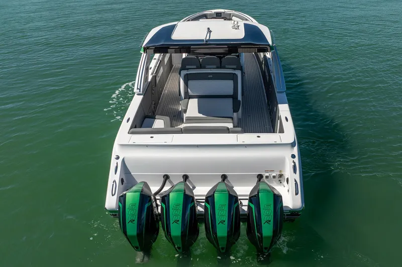 Slide: The Image of 2024 Cigarette 42' Auroris boat with four powerful outboard engines on water. - 32