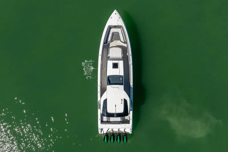 Slide: The Image of 2024 Cigarette 42' Auroris boat on green water, aerial view. - 33