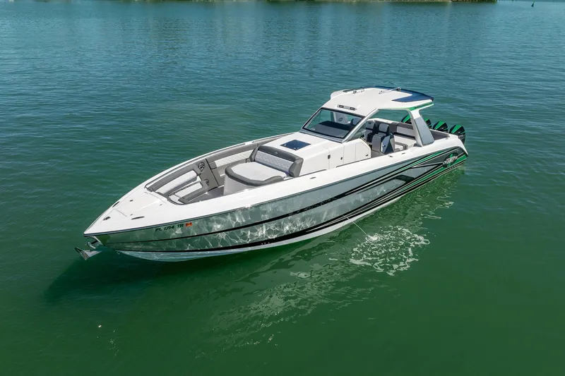 Slide: The Image of 2024 Cigarette 42' Auroris boat on calm water, showcasing sleek design and luxury features. - 37