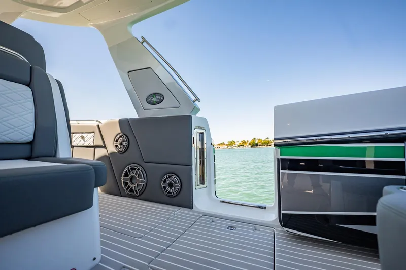 Slide: The Image of 2024 Cigarette 42' Auroris boat interior with sleek seating and water view. - 44