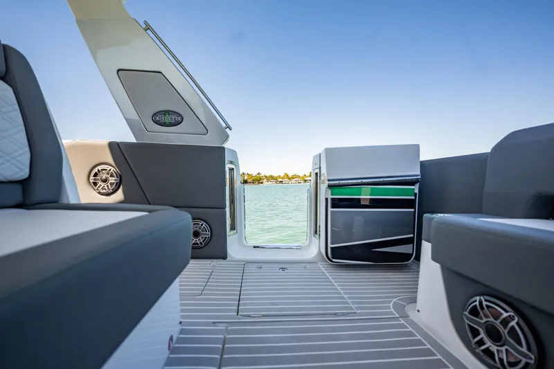Slide: The Image of 2024 Cigarette 42' Auroris boat interior with sleek seating and water view. - 45