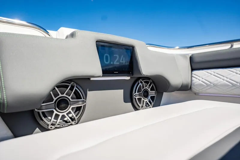 Slide: The Image of 2024 Cigarette 42' Auroris boat interior with speakers and digital display. - 56
